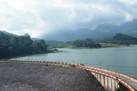 Boating on Anayirangal Lake surrounded by tea estates