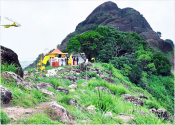 Lord Murugan statue on hill in Kerala