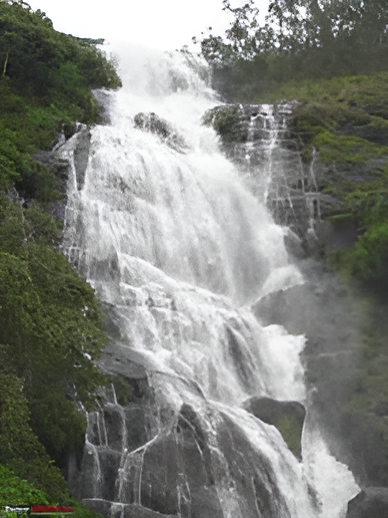 Scenic roadside waterfall on Munnar–Thekkady route