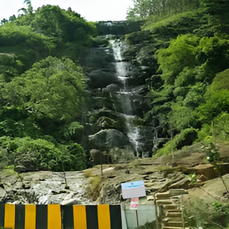 Tourists enjoying the view at Power House Waterfalls Idukki