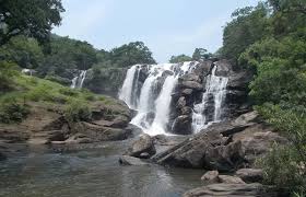 Pambar River waterfall flowing through forest trail near Marayoor