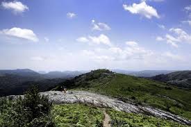 Sunset over lush green valleys at Thrissanku Hills Kerala