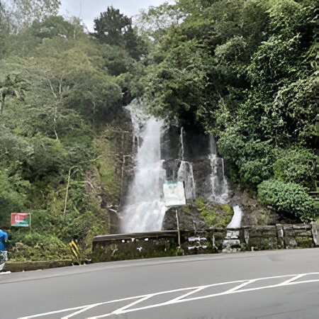Scenic monsoon waterfall along Kottayam-Kumily highway